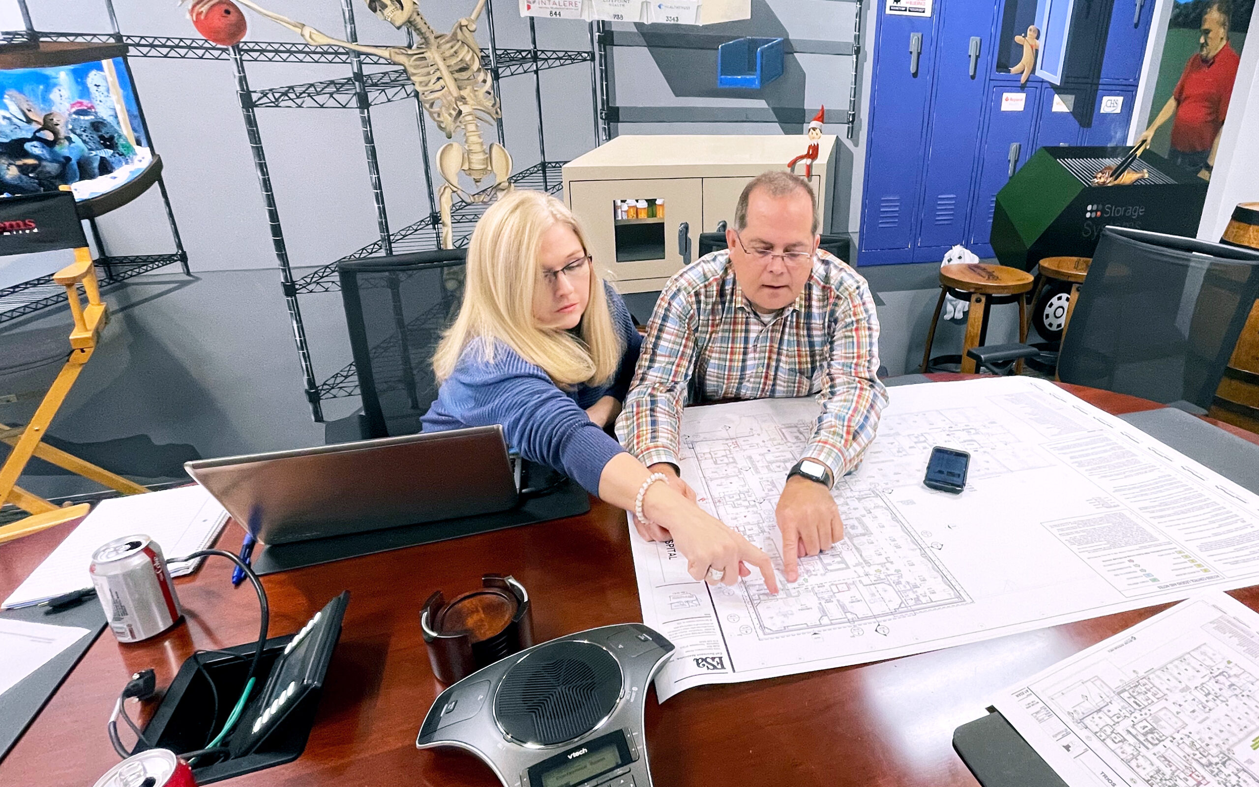 a person sitting at a table using a laptop a person sitting at a table using a laptop